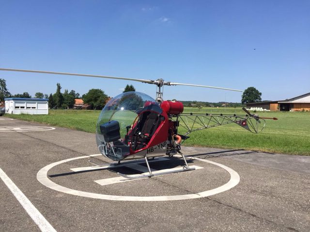red ultralight safari helicopter